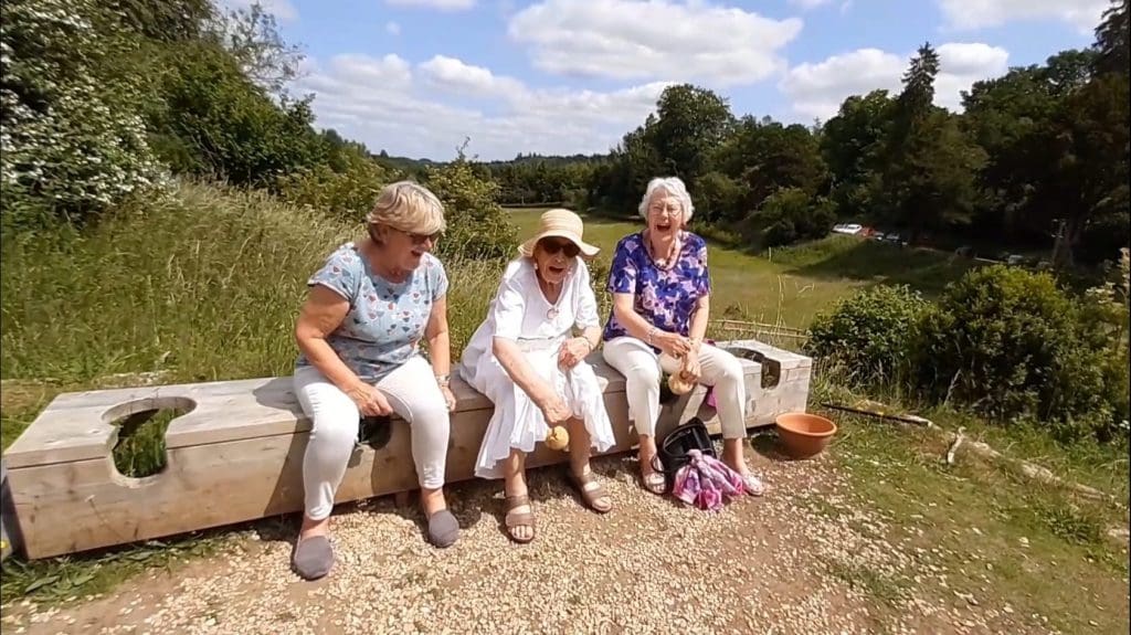 Visitors have a laugh sitting on old Roman style communal loo