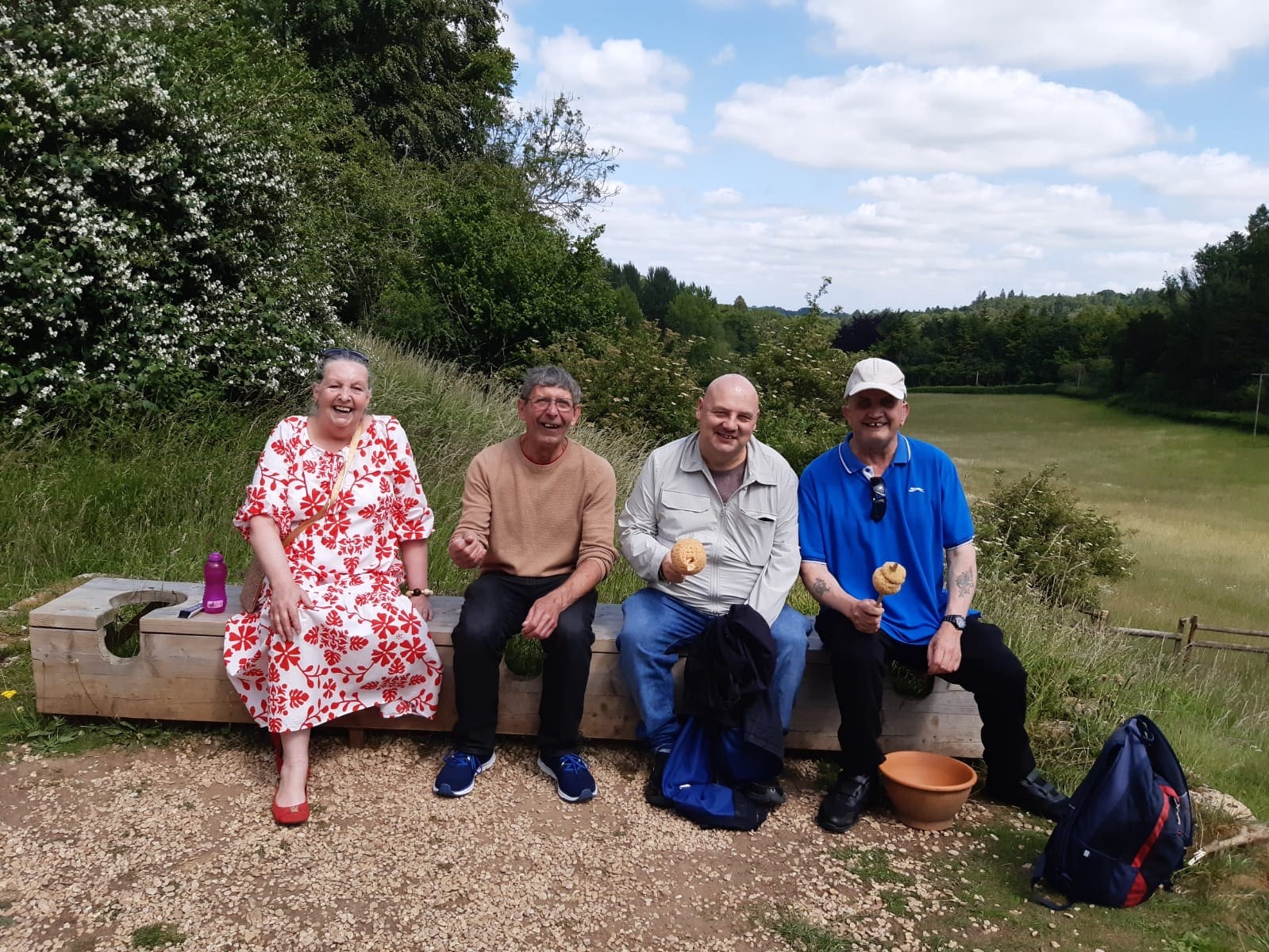 Visitors sitting on outside Roman style communal loo